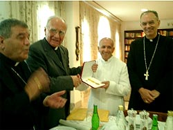 Fr. Dominic Santamaria (center) with the award